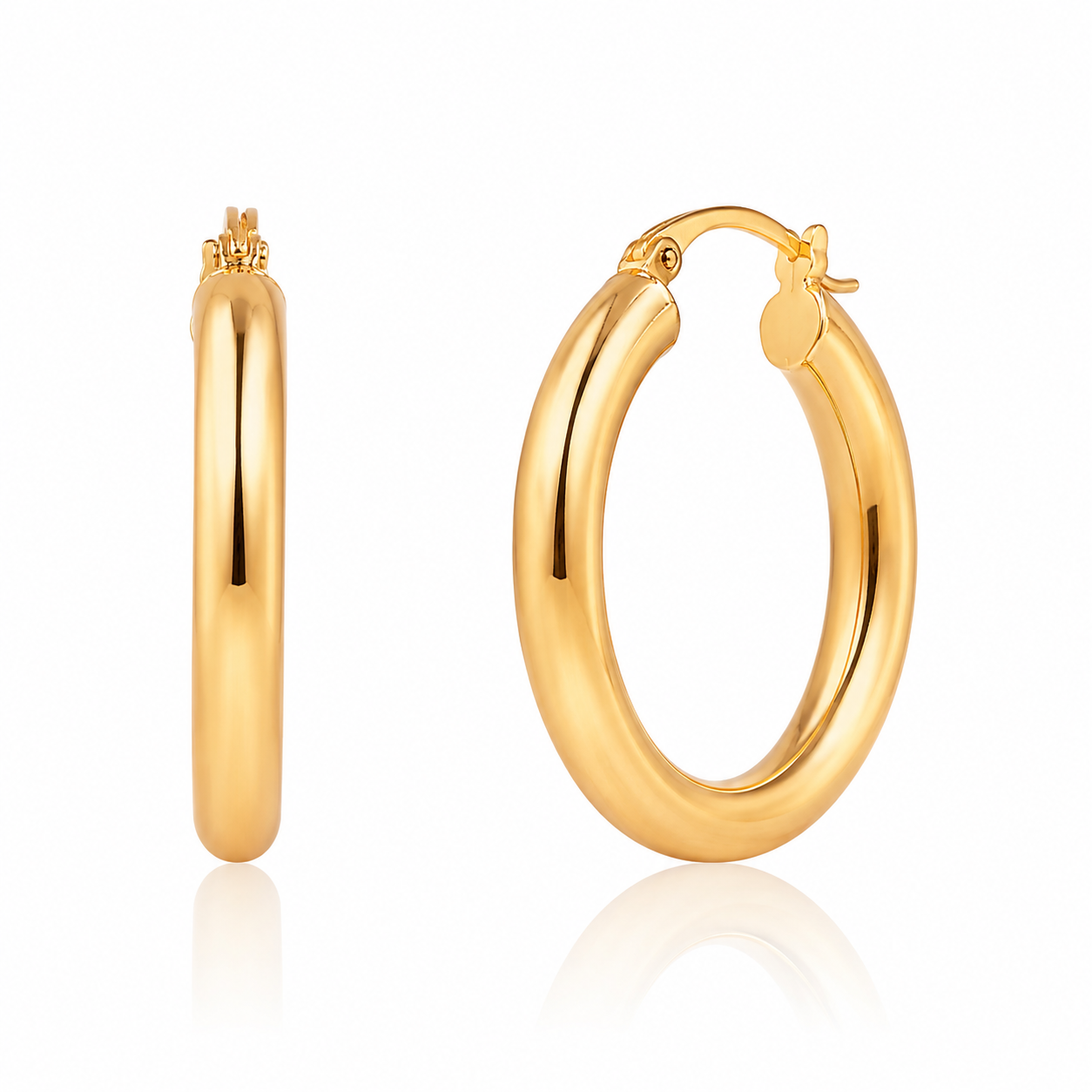Gold hoop earrings on a white background